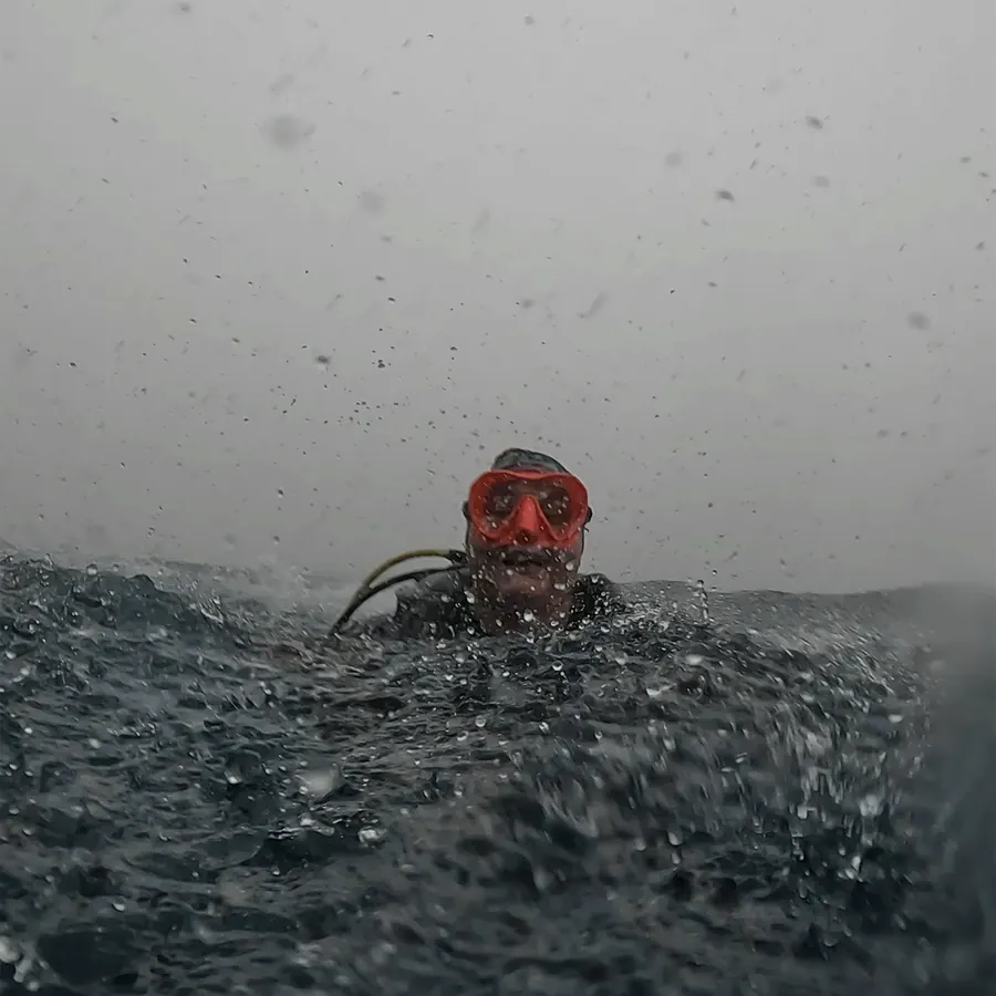 Mariya at the surface in the rain after a dive